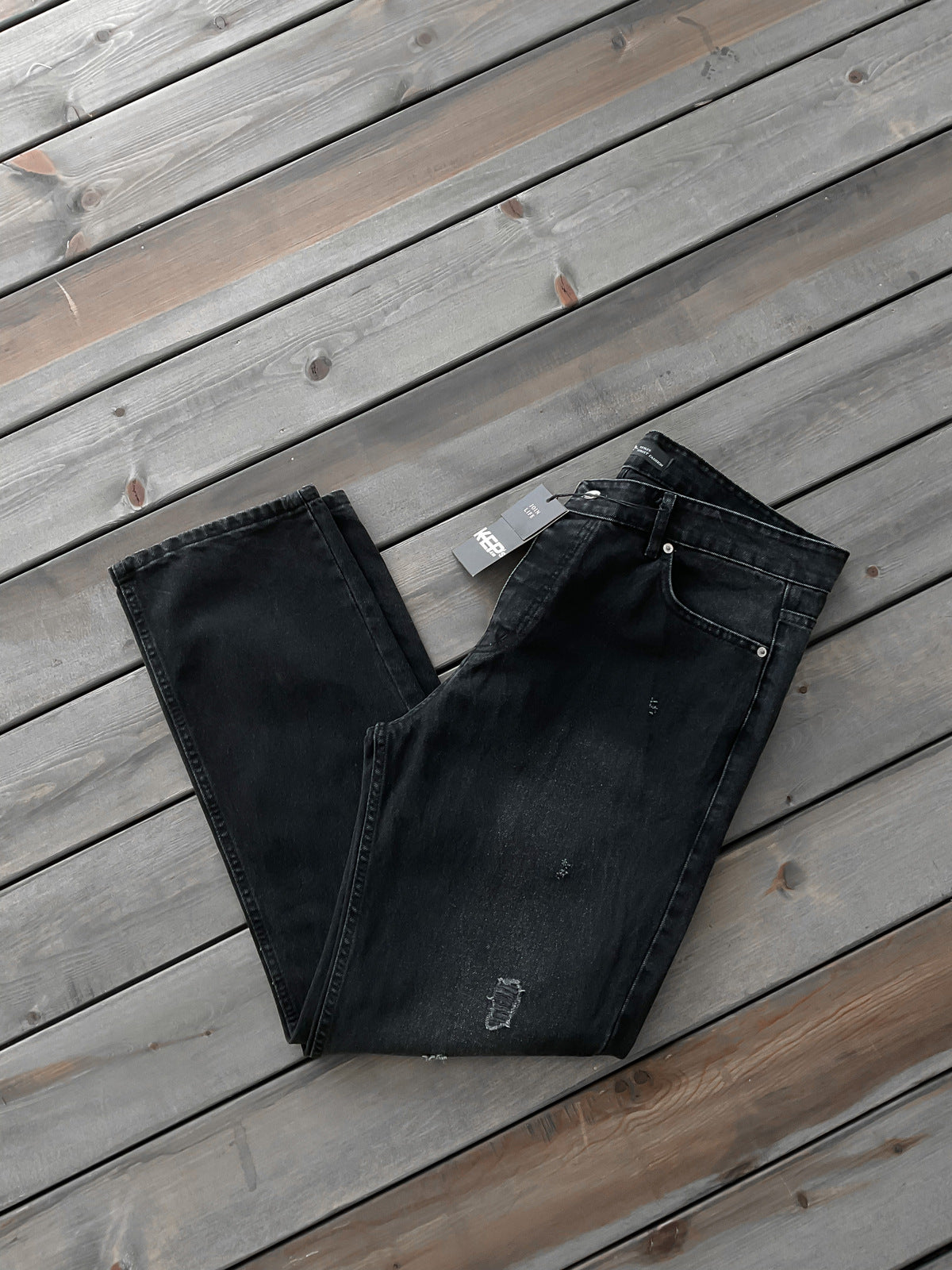 JEANS NOIR DECHIRE